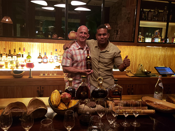 Dave Hoffman from The Curated Travel Collection with bartender at La Reserva during private rum tasting at Four Seasons Costa Rica