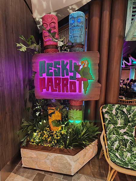 Photo of the entrance to "Pesky Parrot", the new tiki bar on Utopia of the Seas by Royal Caribbean Cruise Lines