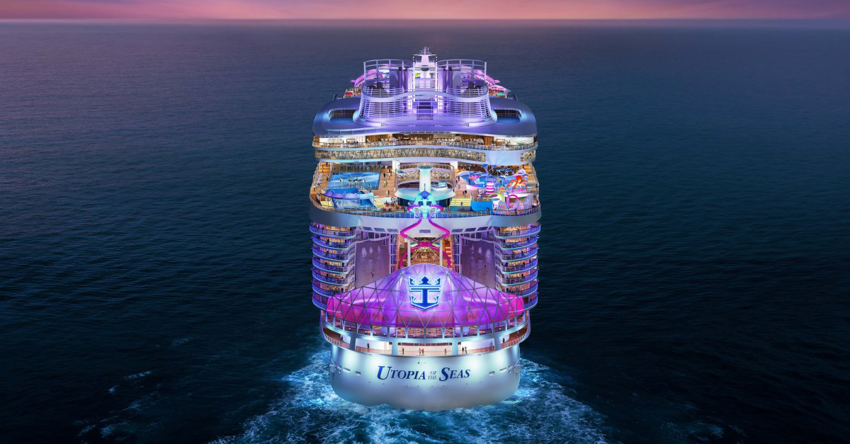 photo of the rear of Royal Caribbean cruise ship Utopia of the Seas, heading toward the horizon at night. 