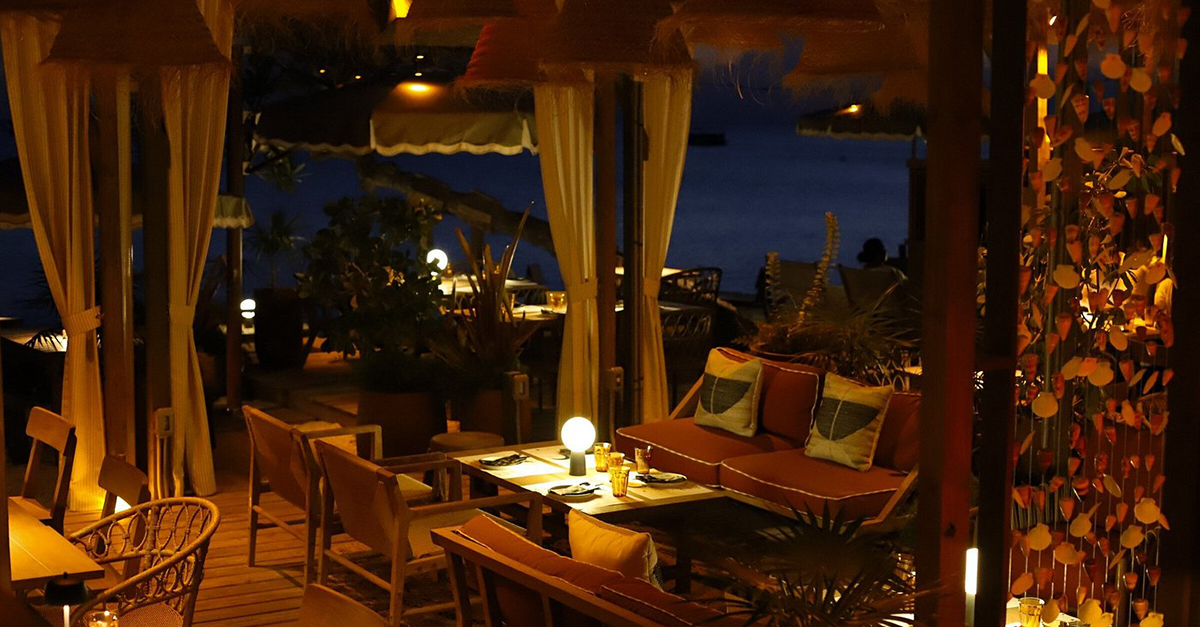 photo of Bonny Moon Beach Club at night, inside the dining room